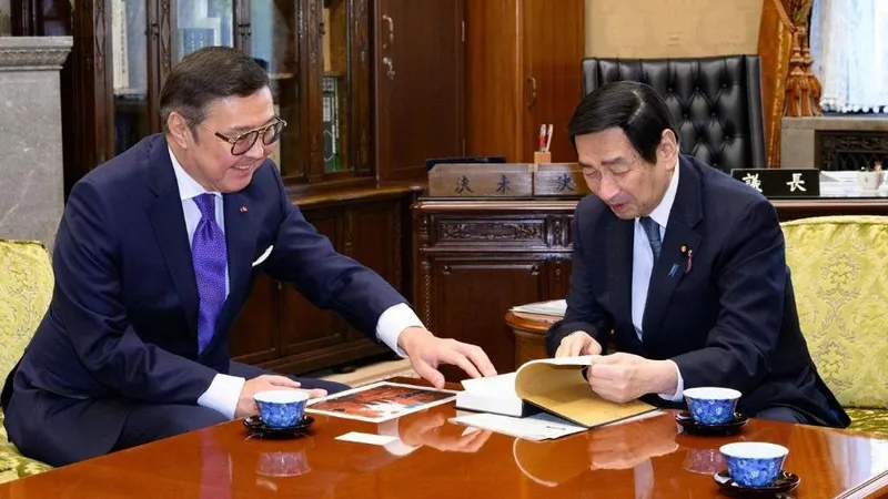 Ерлан Баударбек-Кожатаев, Масаказу Сэкигучи 